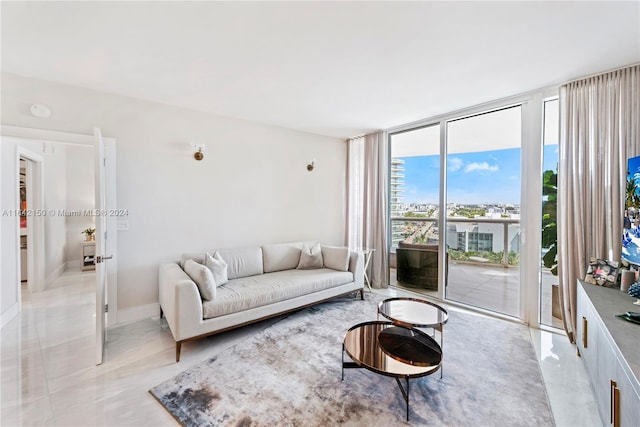 living room featuring floor to ceiling windows and light tile patterned floors