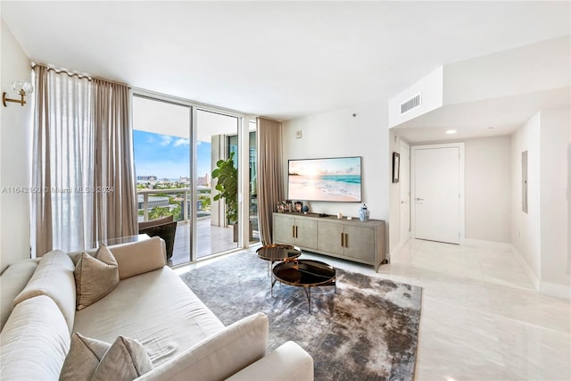 tiled living room featuring expansive windows