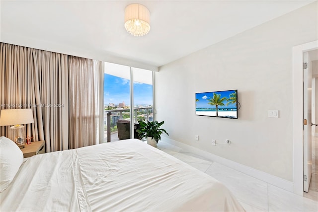 bedroom featuring access to outside and light tile patterned floors