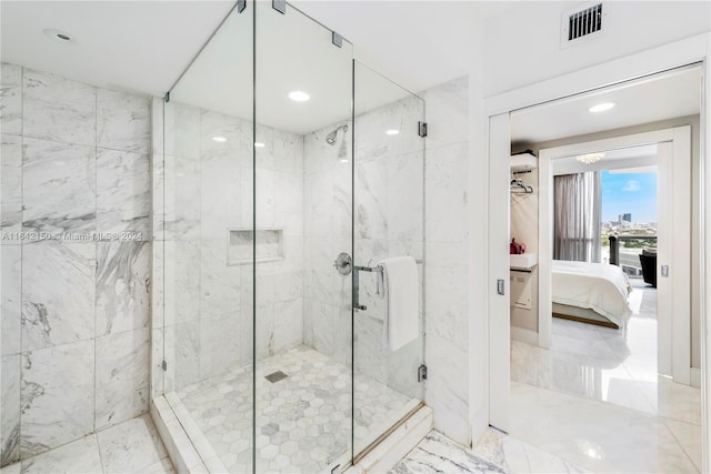 bathroom featuring walk in shower and tile patterned floors