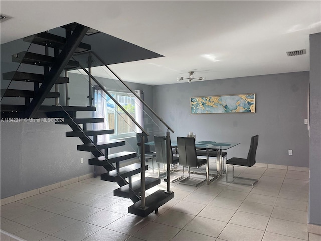 20042 W Lake Dr, Hialeah, FL 33015 - dining room with stairs, tile patterned floors, and a chandelier