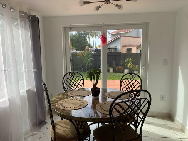 20042 W Lake Dr, Hialeah, FL 33015 - dining space with light tile patterned floors and baseboards