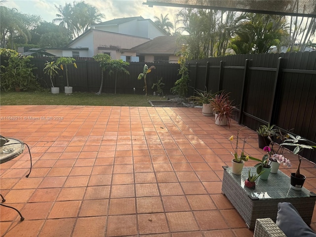 20042 W Lake Dr, Hialeah, FL 33015 - fenced backyard featuring a patio area