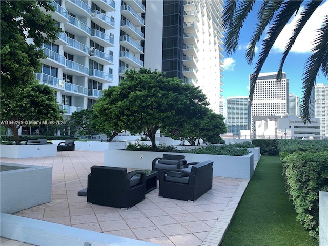 view of patio with a balcony and outdoor lounge area