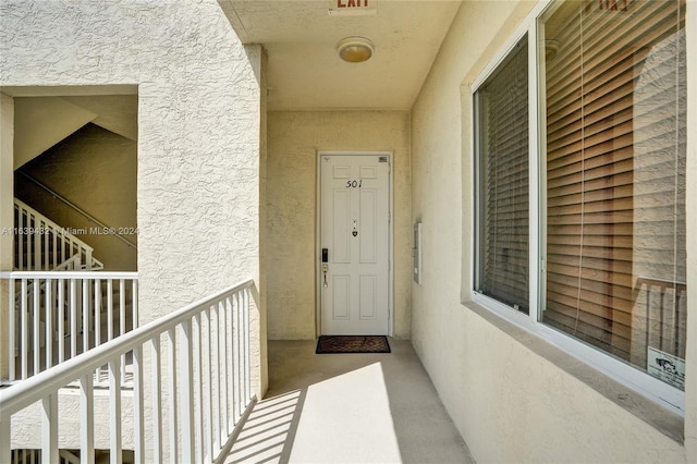 entrance to property featuring a balcony