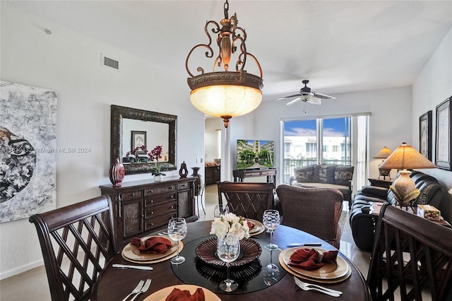 tiled dining room featuring ceiling fan