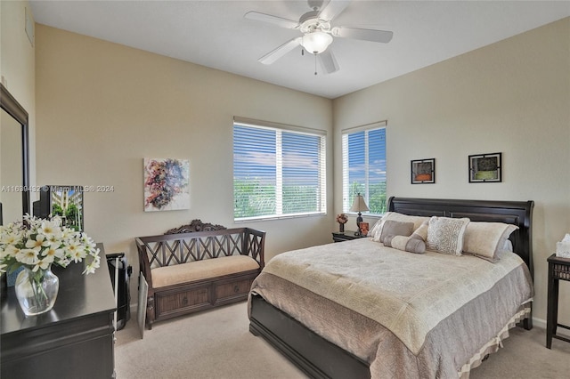 bedroom featuring ceiling fan and light colored carpet