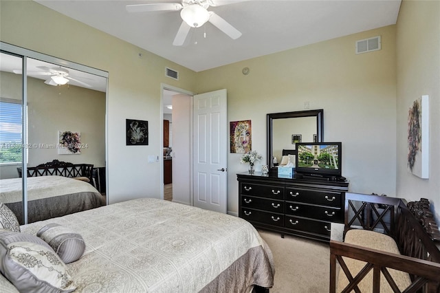 bedroom with carpet, a closet, and ceiling fan