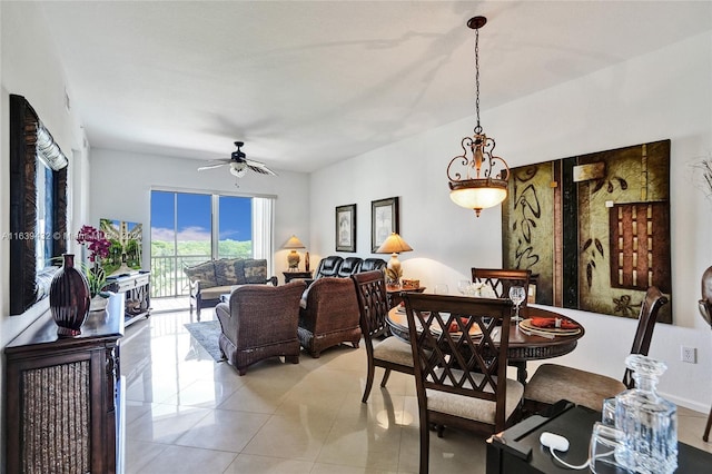 tiled dining room featuring ceiling fan