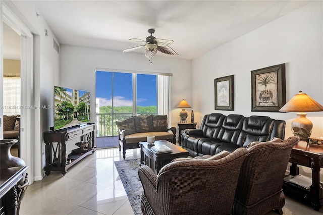 living room featuring light tile patterned floors and ceiling fan