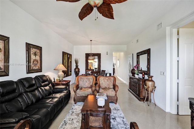 tiled living room featuring ceiling fan