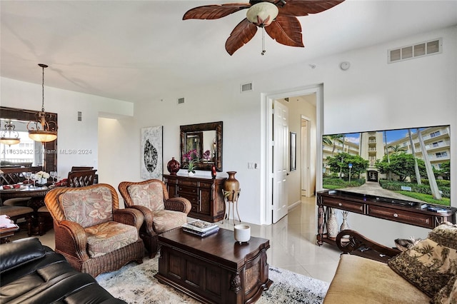 living room featuring ceiling fan and light tile patterned floors