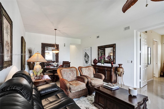 tiled living room featuring ceiling fan