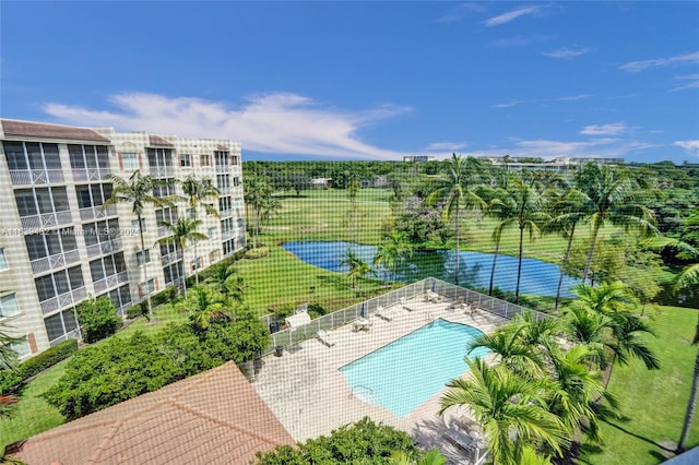 view of pool featuring a patio area and a yard