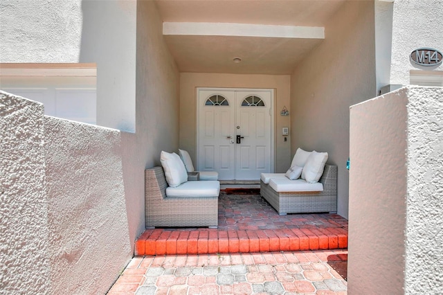 doorway to property with stucco siding