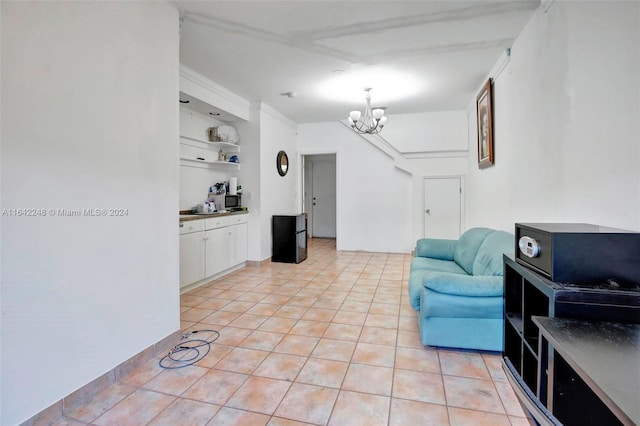 interior space with light tile patterned floors, built in shelves, and an inviting chandelier