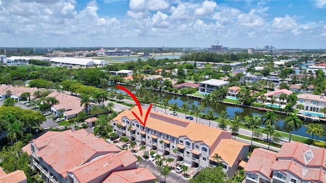 birds eye view of property with a residential view and a water view