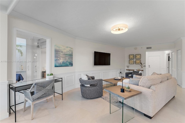 living room with crown molding and a textured ceiling