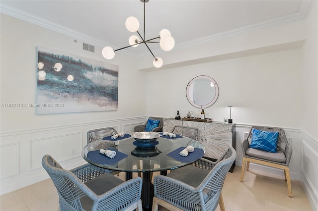 dining space featuring crown molding and an inviting chandelier