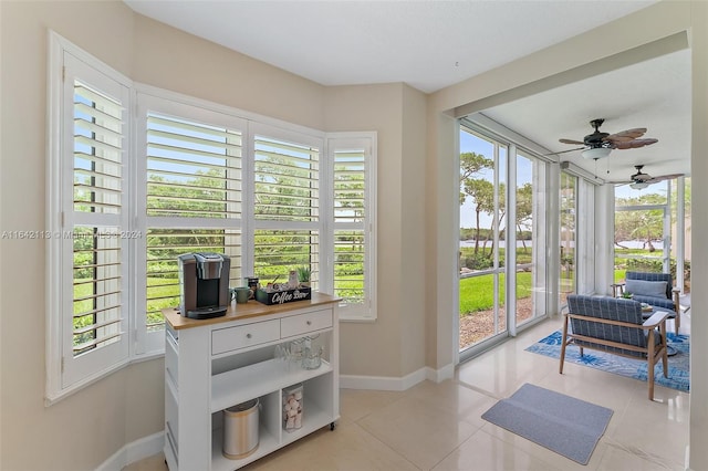 sunroom / solarium with ceiling fan