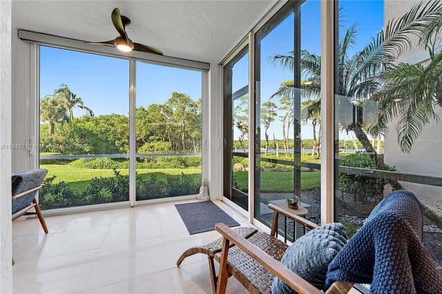 sunroom with ceiling fan and a healthy amount of sunlight