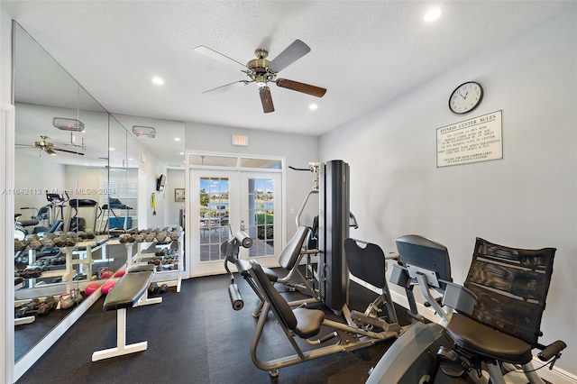 exercise room featuring french doors, a textured ceiling, and ceiling fan