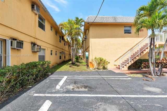 view of parking / parking lot featuring stairway