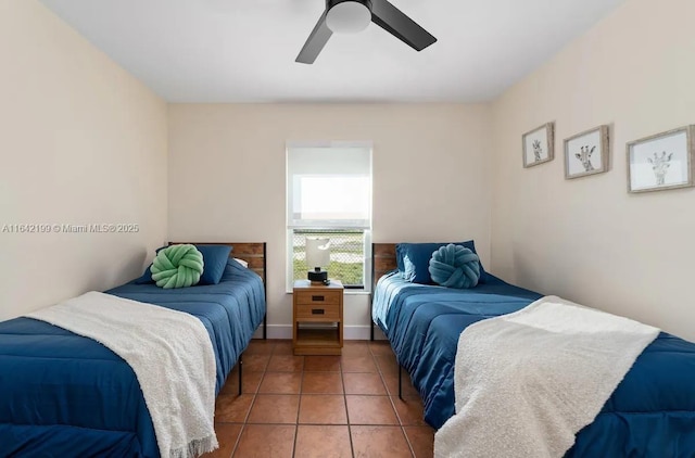 tiled bedroom featuring ceiling fan