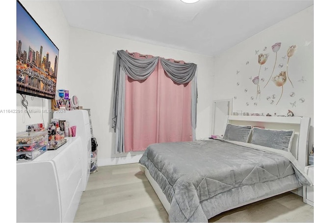 bedroom with light hardwood / wood-style flooring