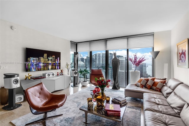 living room with a wall of windows and tile patterned floors