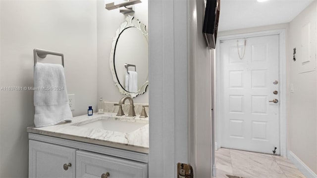 bathroom with vanity and baseboards