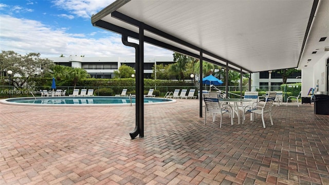 pool featuring a patio and fence