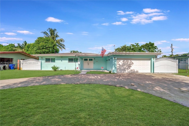 single story home featuring a garage and a front yard