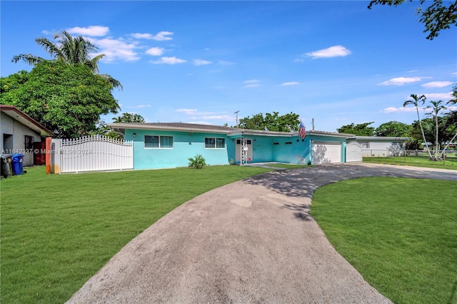 view of front facade with a front lawn and a garage