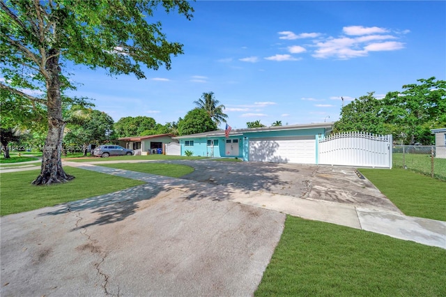 ranch-style house with a garage and a front yard