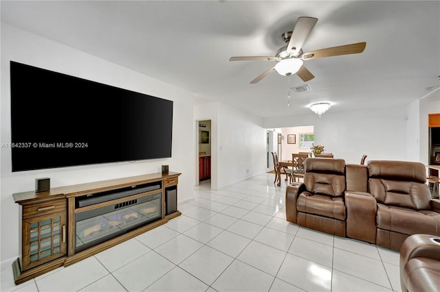 living room with ceiling fan and light tile patterned flooring