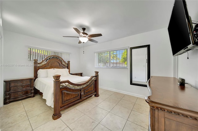 tiled bedroom with ceiling fan