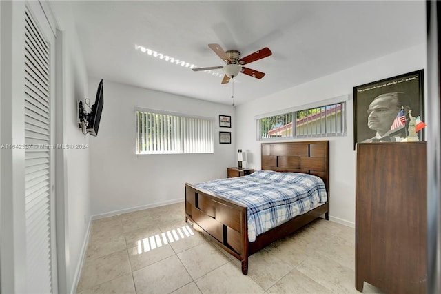 bedroom featuring ceiling fan and light tile patterned flooring