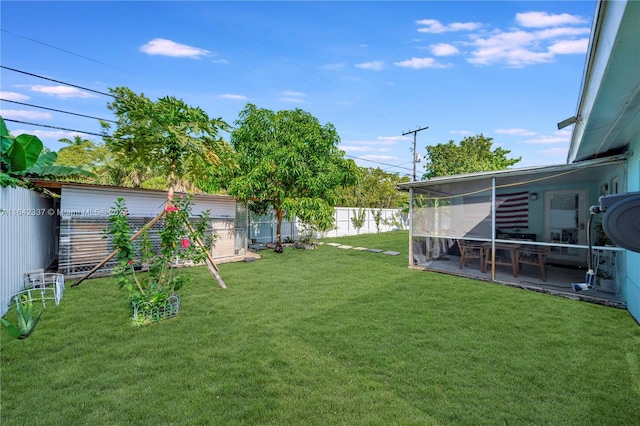 view of yard with a patio and a sunroom