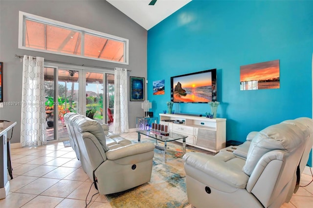 tiled living room with french doors and high vaulted ceiling