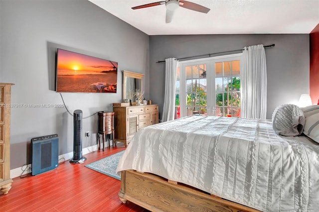 bedroom with hardwood / wood-style flooring, ceiling fan, and lofted ceiling