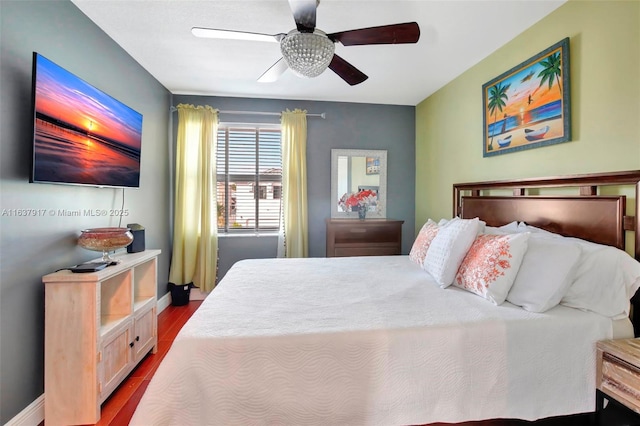 bedroom featuring hardwood / wood-style floors and ceiling fan