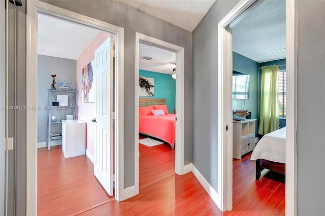 hallway featuring wood-type flooring