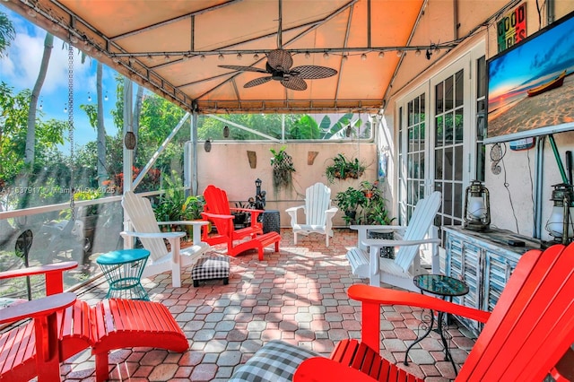 view of patio featuring ceiling fan