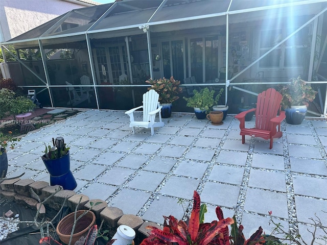 view of patio with a lanai and a sunroom