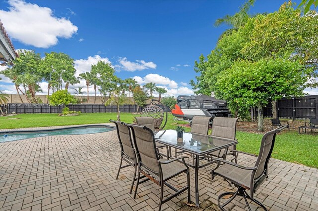 view of patio / terrace with a fenced in pool