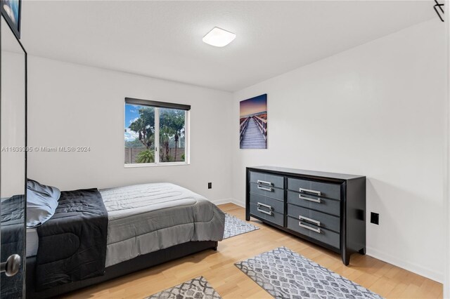 bedroom with light hardwood / wood-style flooring