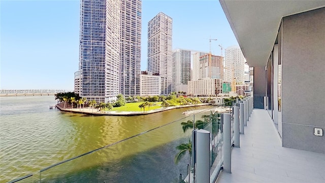 balcony featuring a water view