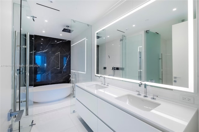 bathroom with vanity, plus walk in shower, and tile patterned floors