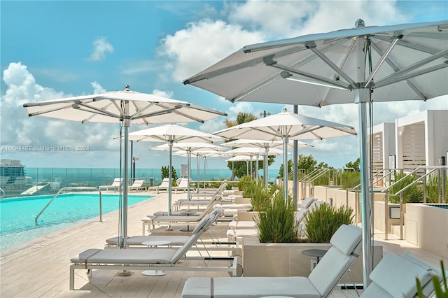 exterior space with a patio area and a beach view